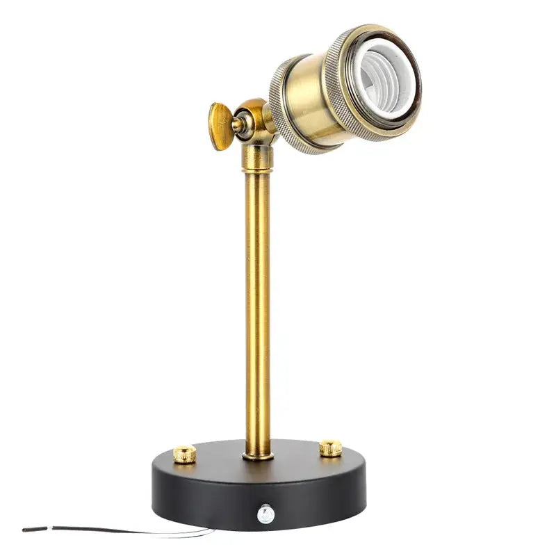 American single-head industrial wall lamp in brass finish with black base and adjustable spotlight