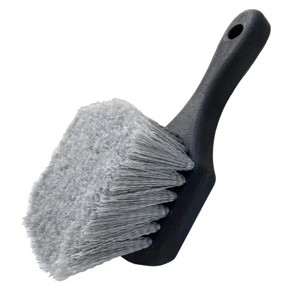 Car wheel cleaning brush by Simples Market with short black handle and dense gray bristles.