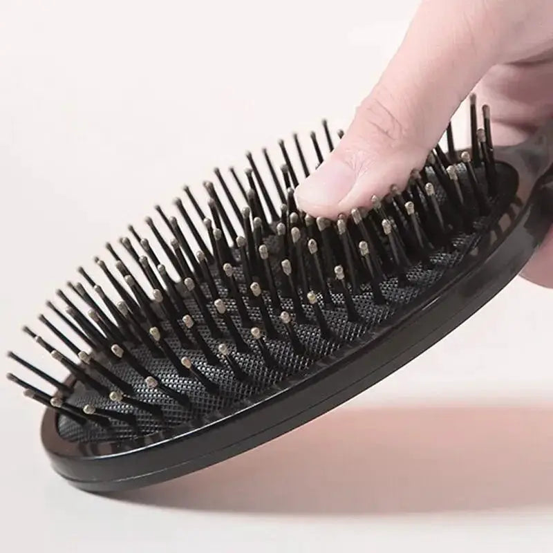 Air Bag anti-static hair brush by Simples Market, black plastic handheld spa massager for curly hair