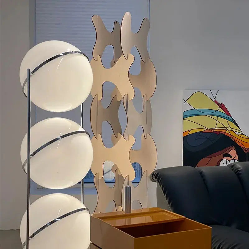 Modern white acrylic circular LED floor lamp with stacked globe shades by Simples Market for living room decor