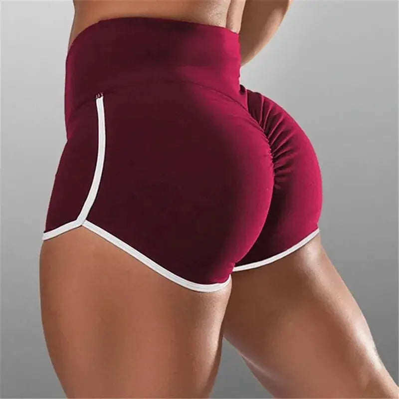 Women’s burgundy high-waisted athletic shorts with white piping, stretchy fabric for gym workouts and yoga