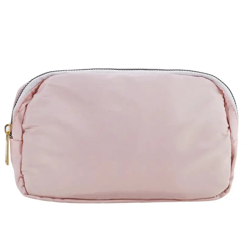 Pink zippered waist bag for women; compact fanny pack.