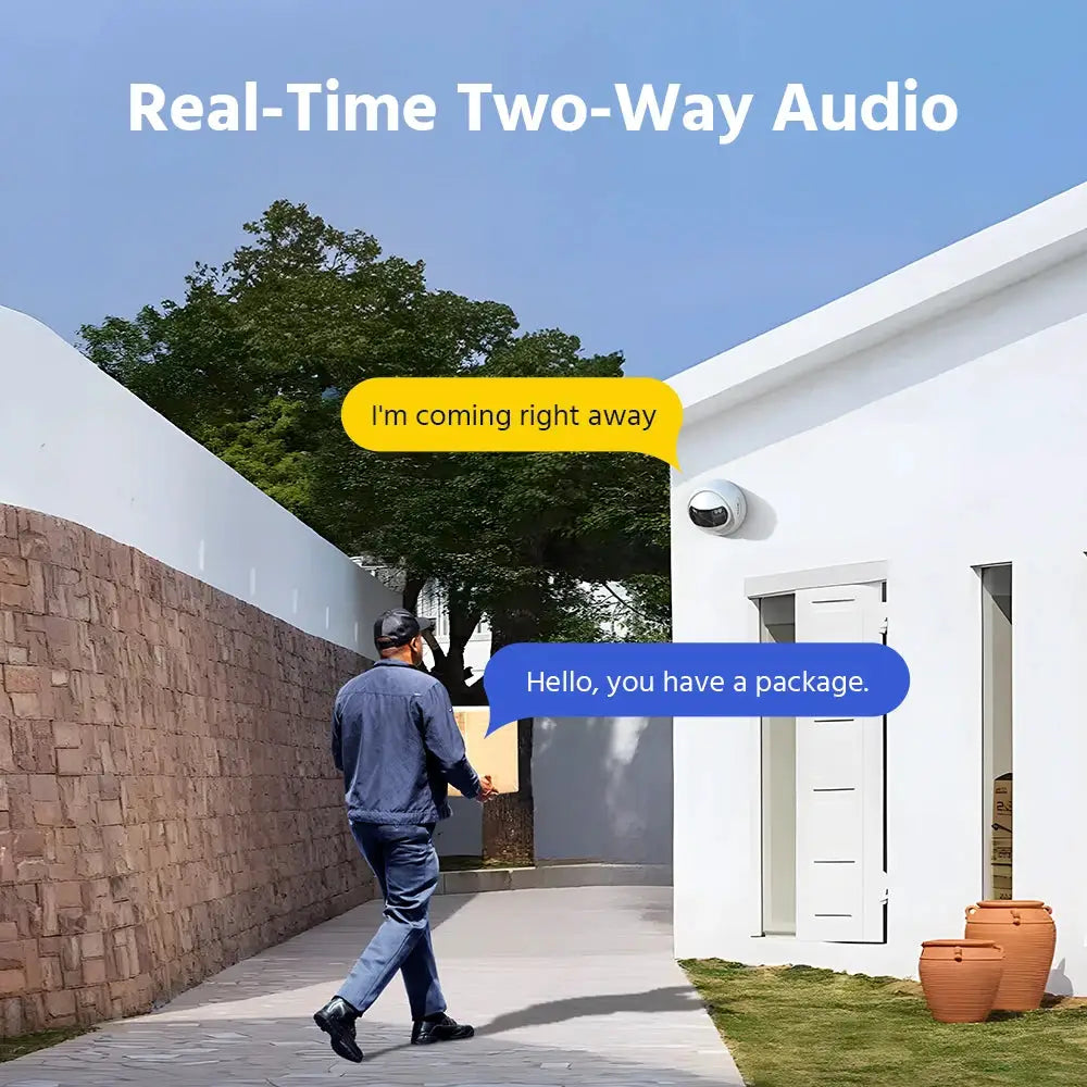 White outdoor dome security camera mounted on a white wall beside a doorway.