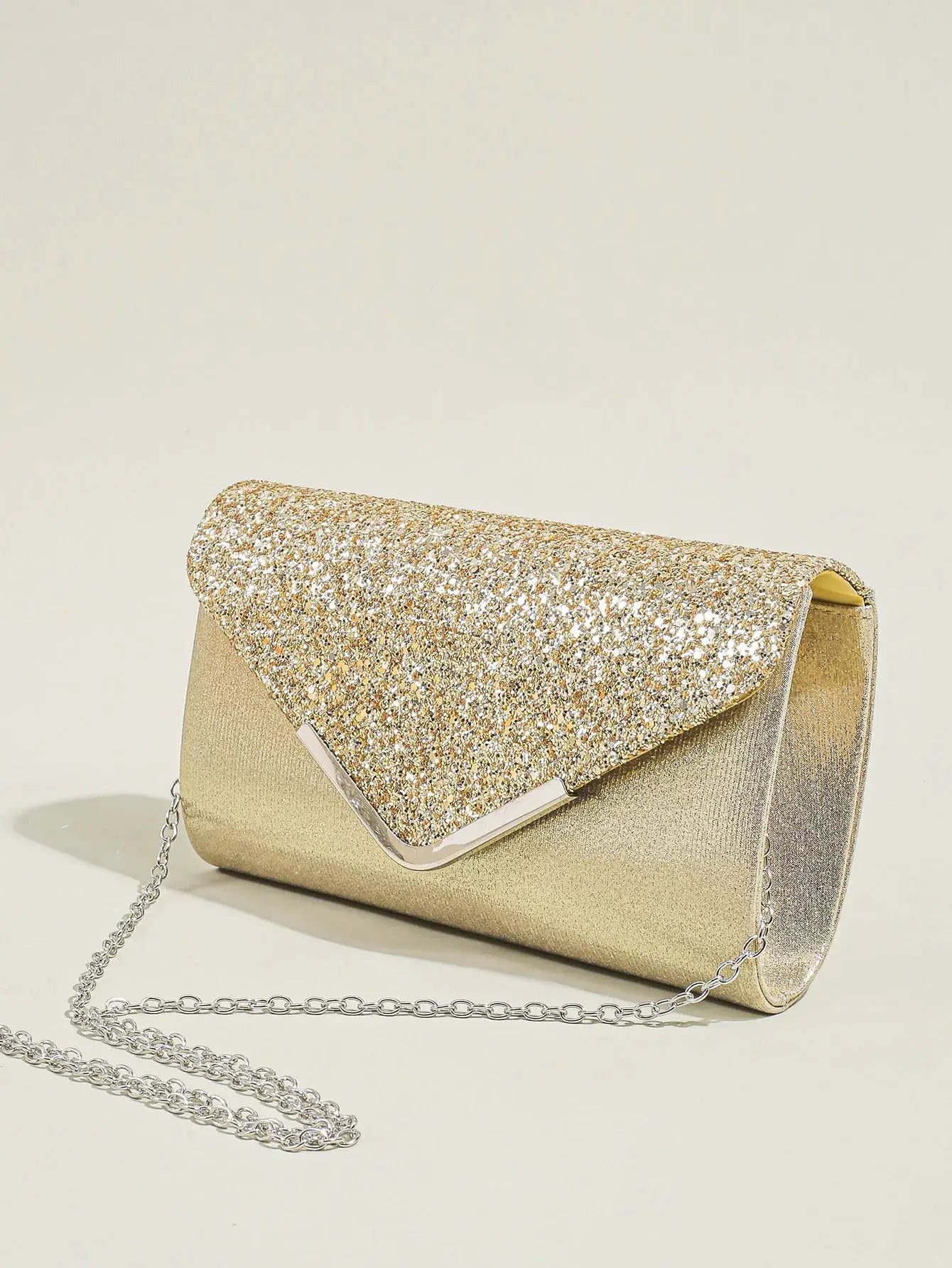 Envelope clutch purse in gold sequins by Simples Market with a silver chain strap