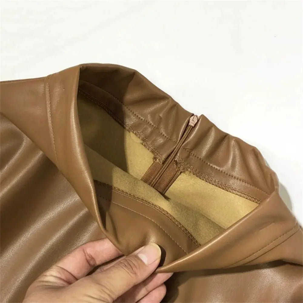 Women's PU leather midi skirt by Simples Market; tan-brown exterior, high-waist A-line with back zipper