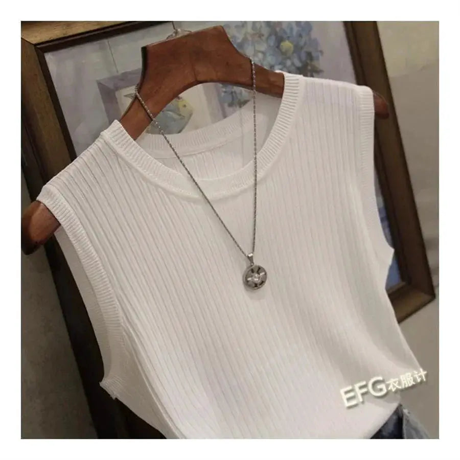 White sleeveless ribbed knit blouse by Simples Market on a hanger