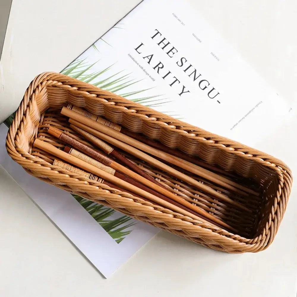 Imitation rattan storage basket, brown faux wicker finish with wooden utensils inside