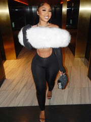 Sisterlinda black furry slash-neck jumpsuit with white fluffy stole and glitter clutch