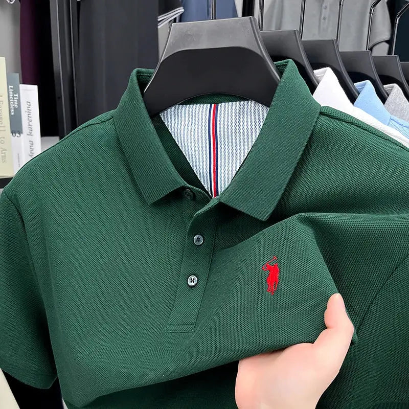 Set of polo shirts on rack, green polo with red pony embroidery, 100% cotton, Simples Market.