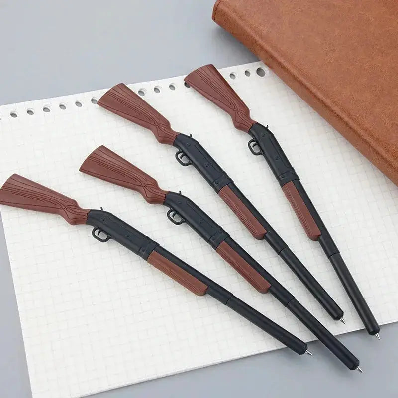 Gun-shaped writing pens by Simples Market; four brown and black ballpoint pens with textured grips