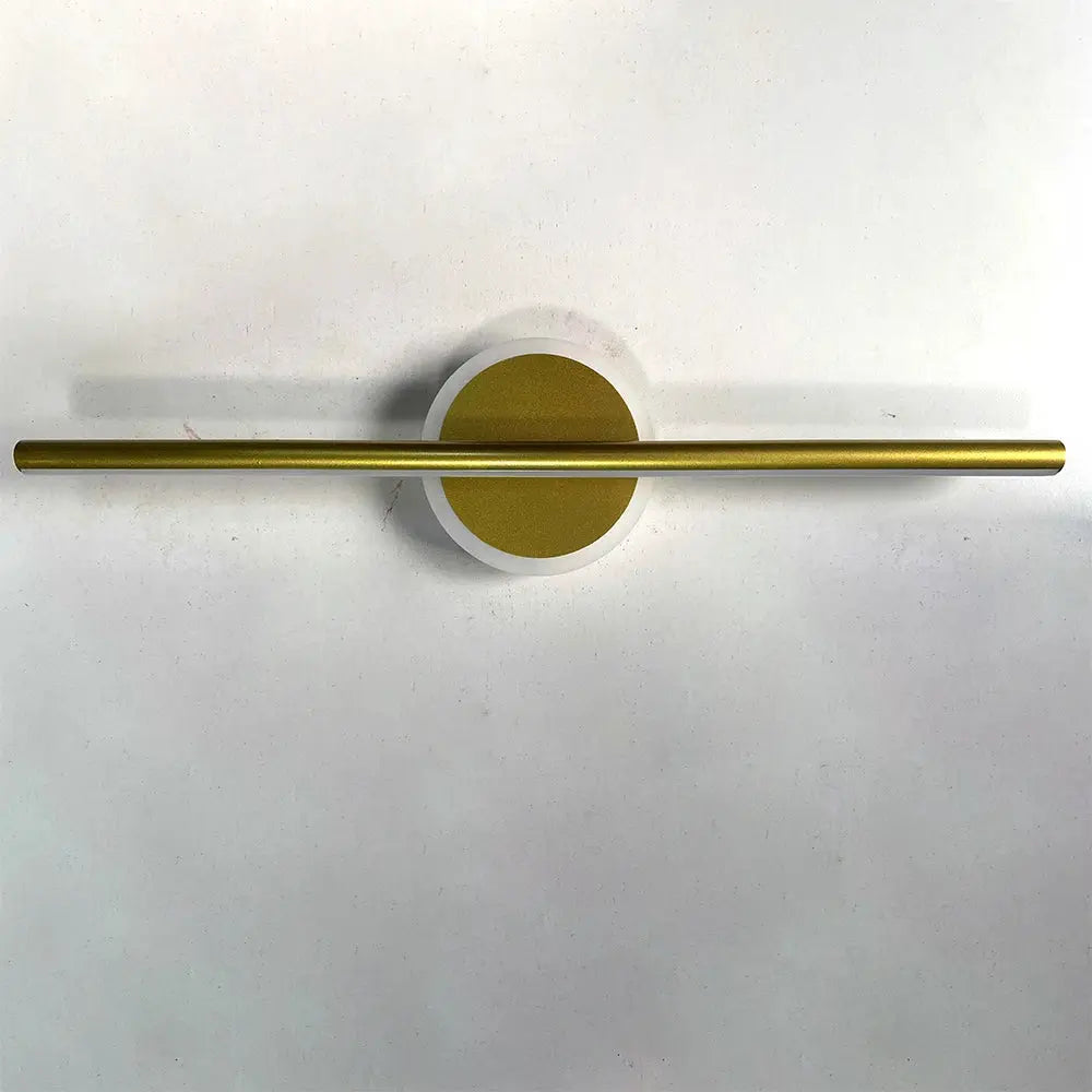 Modern LED wall lamp with a long gold bar across a white circular backplate