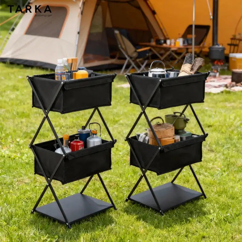 TARKA camping three-tier folding storage rack in black with fabric bins; two units shown for outdoor BBQ storage