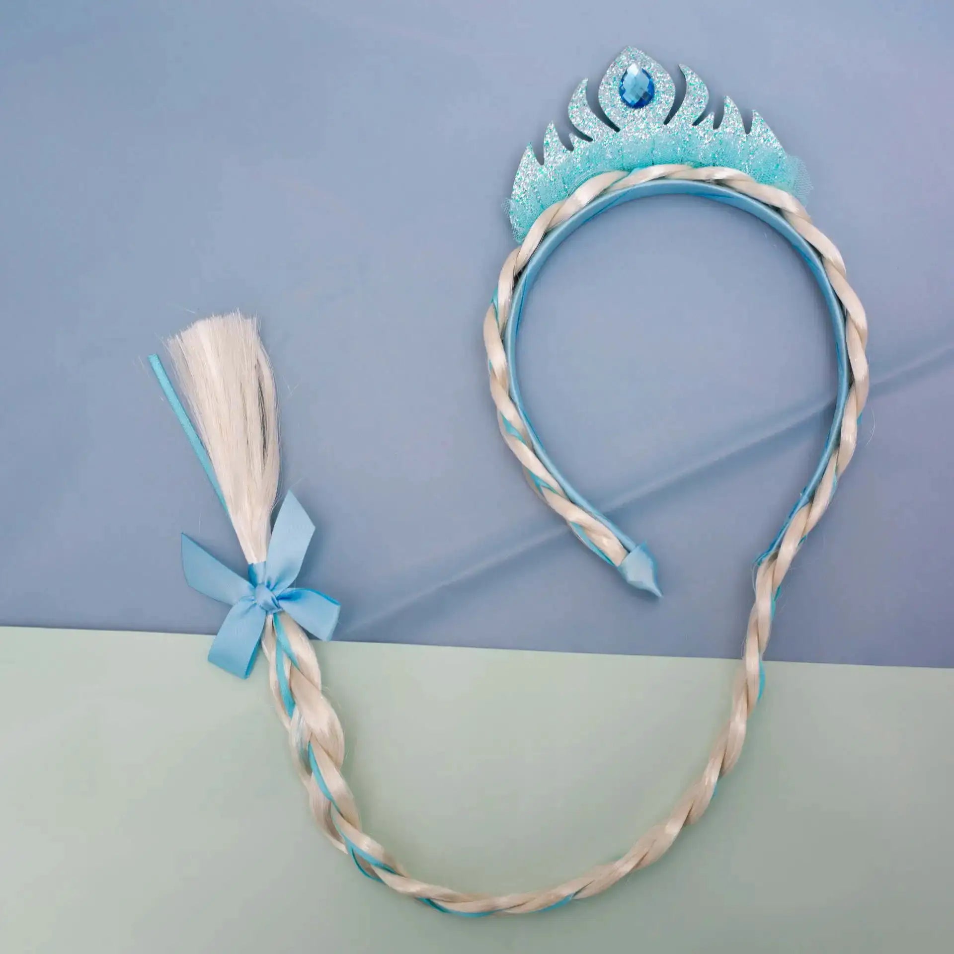 Elsa princess crown headband for kids with glittery turquoise crown and blue gem, braided cord with blue bow
