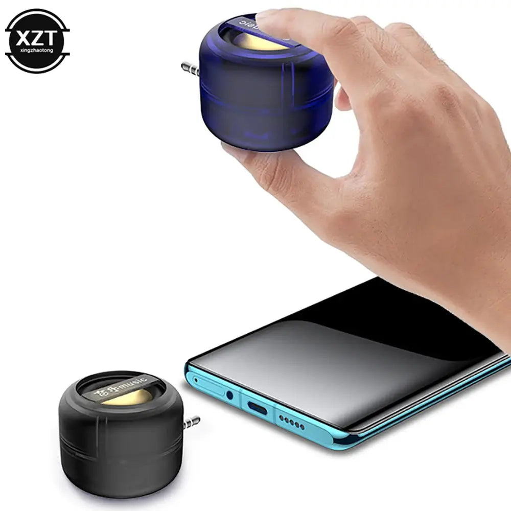 Simples Market portable mini speaker pair with 3.5mm plug; blue and black units with XZT logo beside a smartphone