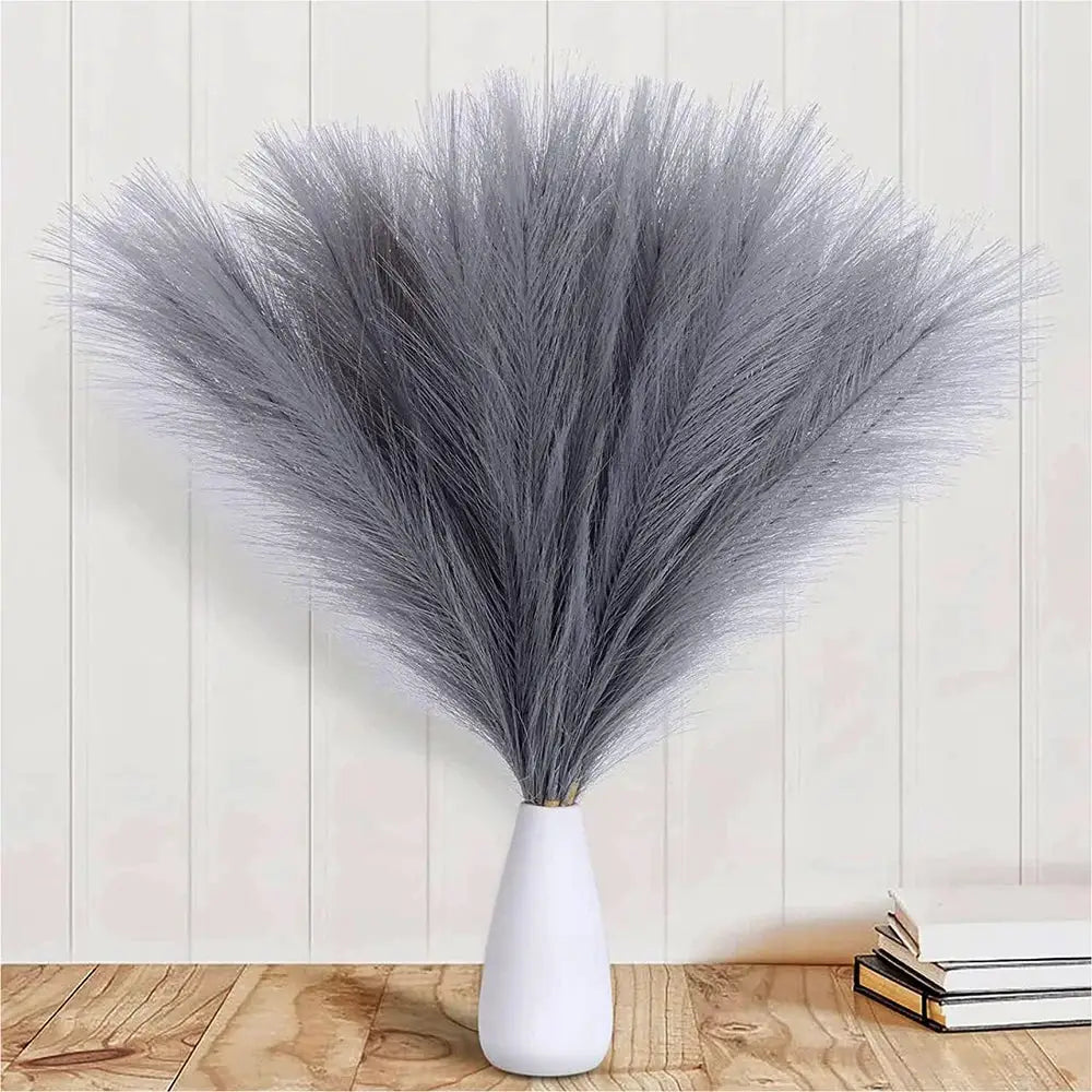 Fluffy pampas grass bouquet in a white ceramic vase, gray lavender tones for home decor