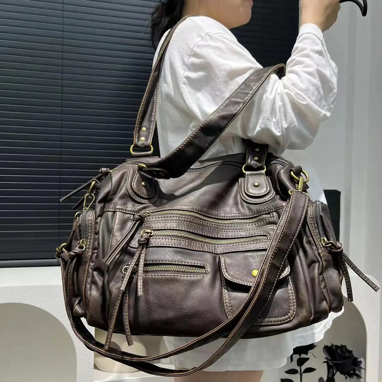 Y2K hot girl crossbody bag in washed brown leather with multiple zip pockets and brass hardware by Simples Market.