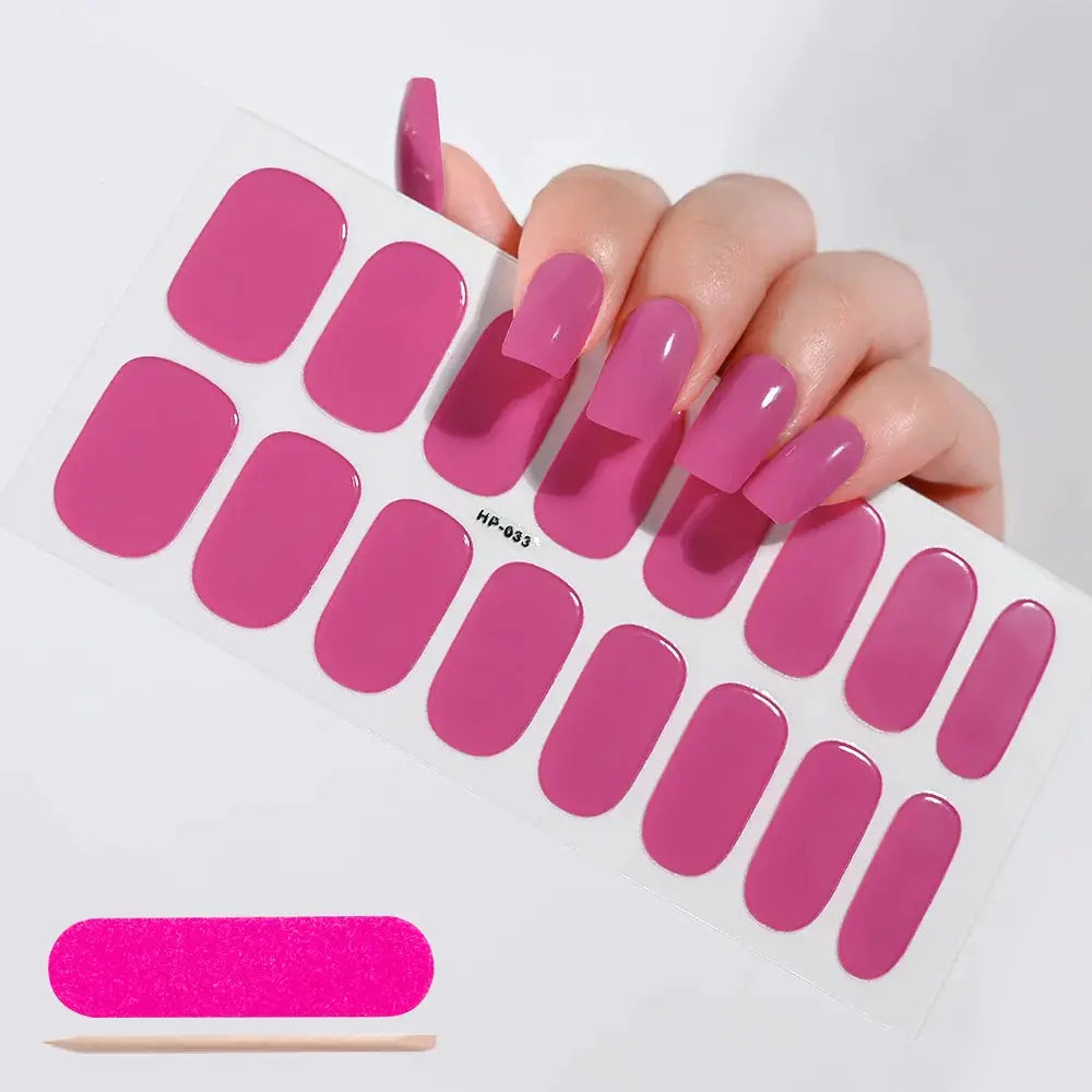 Nail wrap sheet with 16 glossy pink magenta full-cover decals for nails
