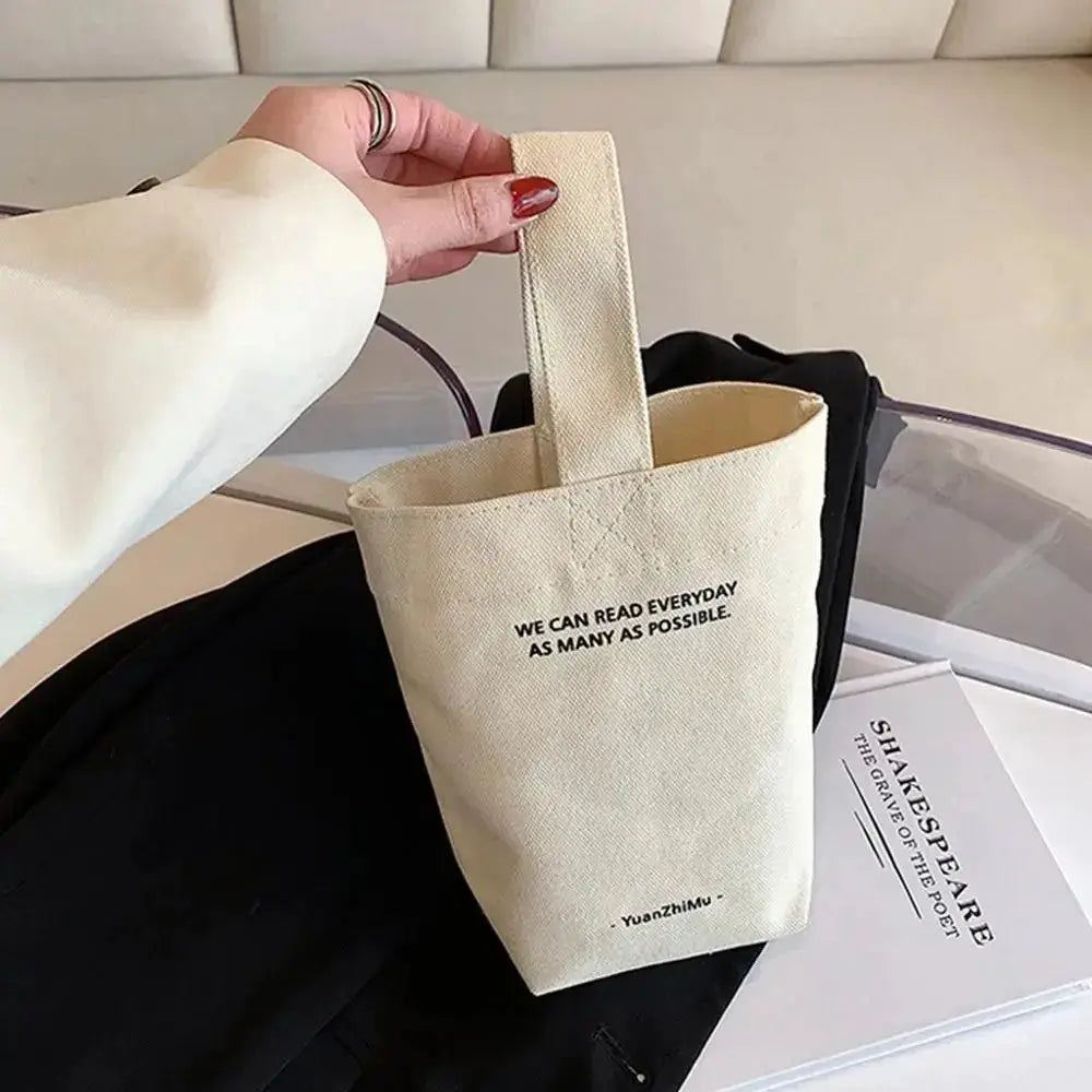 Canvas crossbody bag in beige by Yuanzhimu; casual large-capacity shopper handbag.