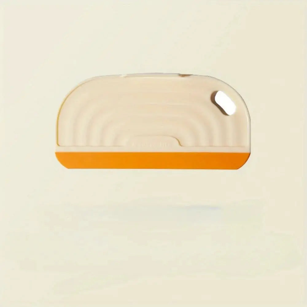 Soft silicone non-scratch handheld squeegee by Simples Market with orange edge