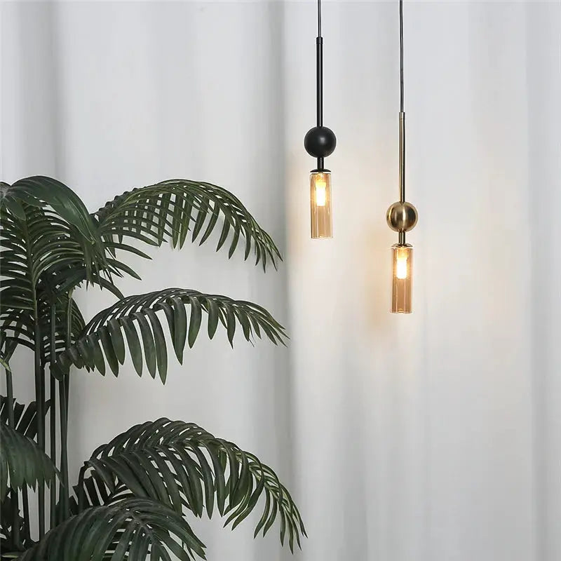 Simples Market Nordic luxury pendant lights, gold and black iron with glass cylinders, two hanging lamps.