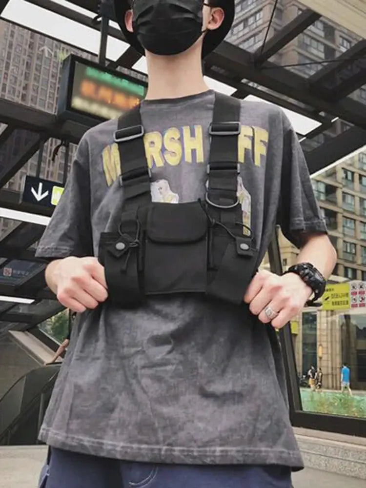 Black functional tactical chest rig bag with front pockets worn across the chest