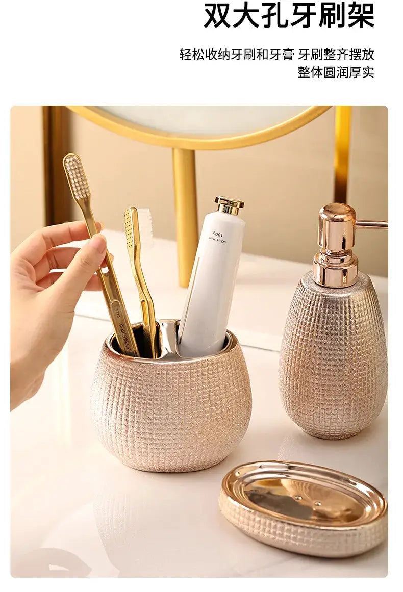 Rose-gold ceramic bathroom accessories set by Simples Market including toothbrush holder, mouthwash cup, lotion bottle and soap dish.
