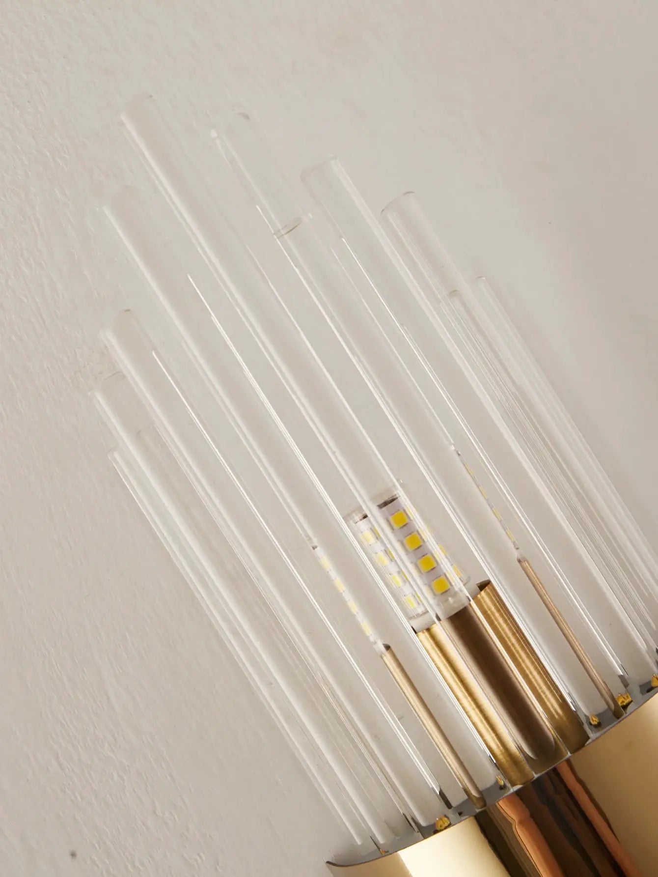 Gold-brass finish crystal wall sconce with clear glass rod accents and G9 LED modules