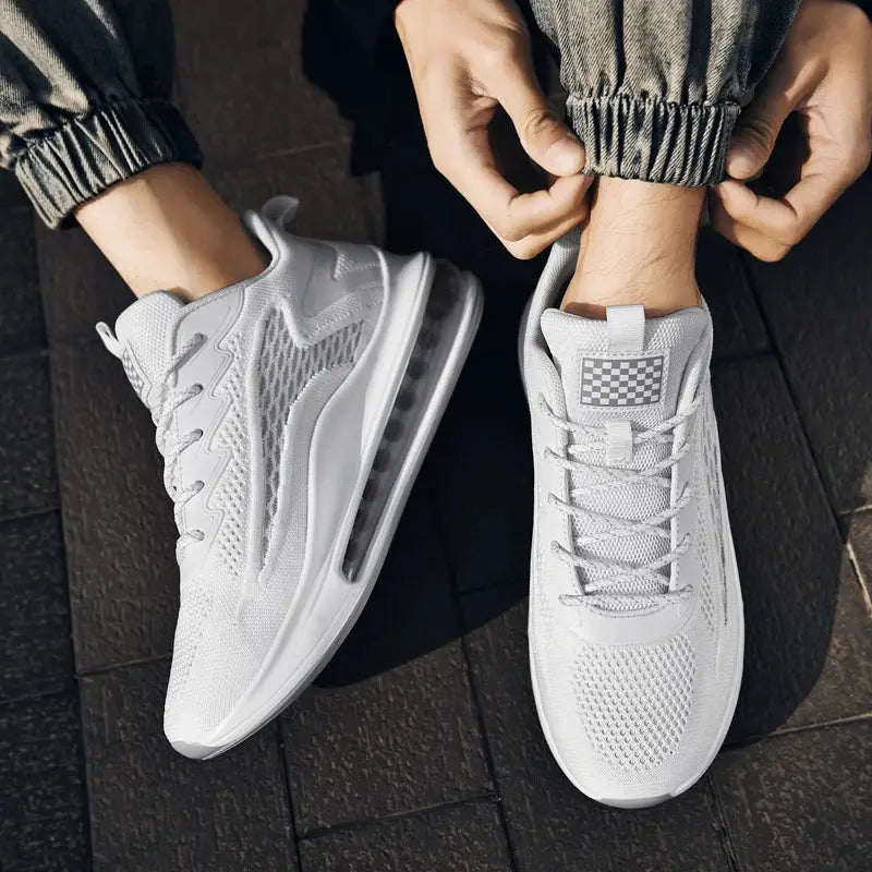Men's white sneakers by Simples Market with breathable mesh upper and visible air-cushioned sole