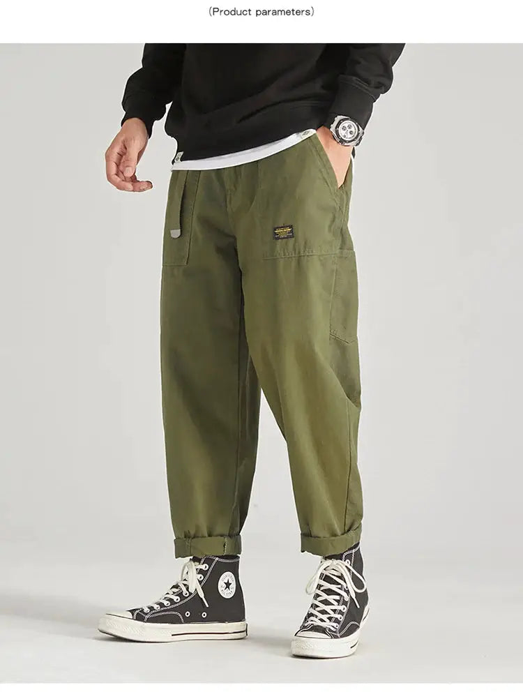 HIQOR men's cargo pants in olive green with multiple pockets and rolled cuffs.