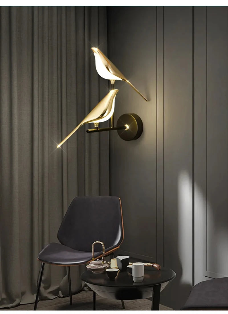 Simples Market modern LED wall lamp featuring two gold-tone magpie bird figures on a circular wall mount