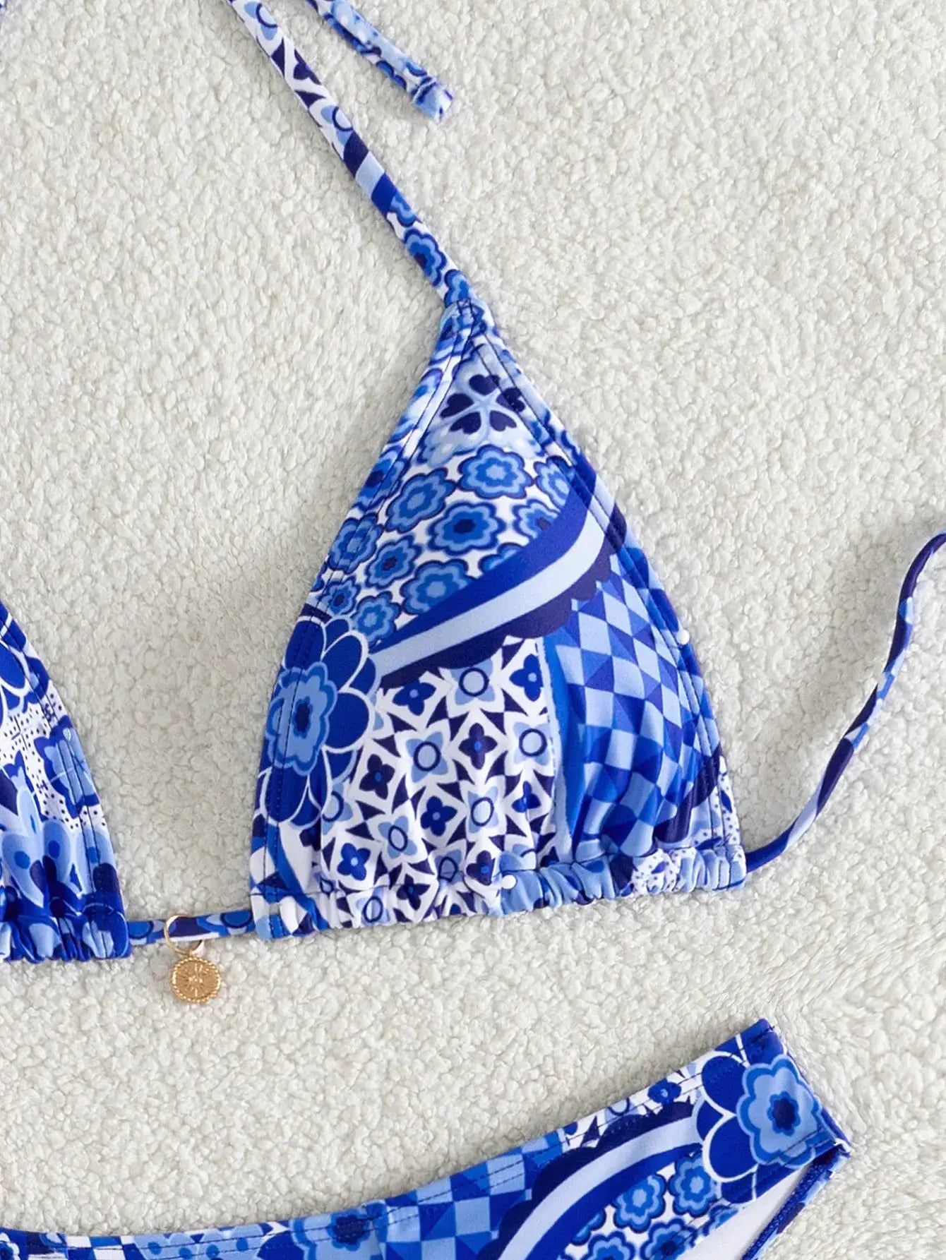Simples Market 2026 triangle bikini set in blue floral print; push-up top with Brazilian bottoms