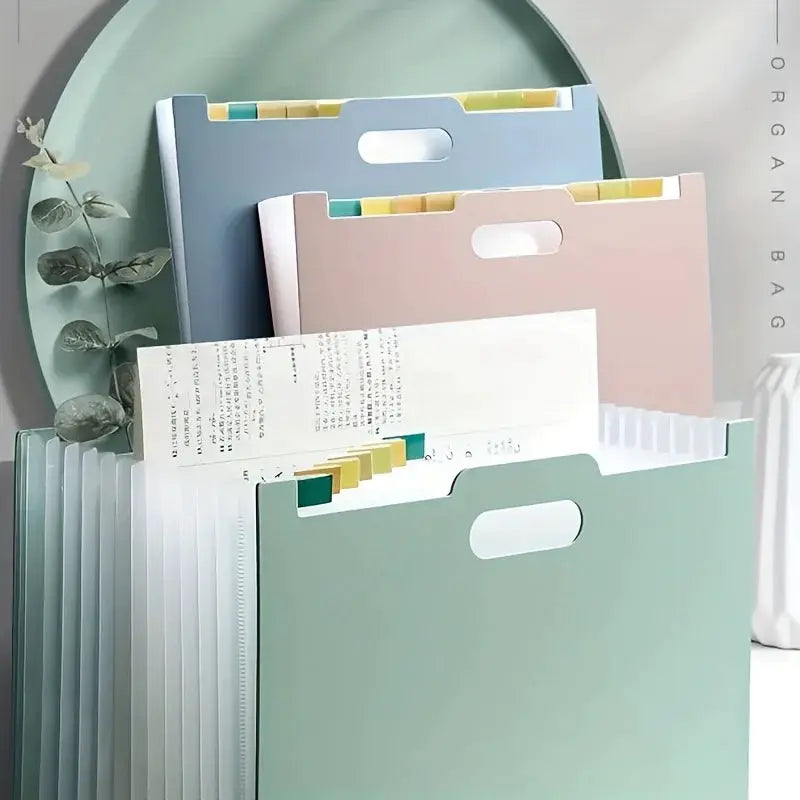 Set of 3 pastel A4 foldable file storage boxes with multiple pockets in mint green, blue and pink.