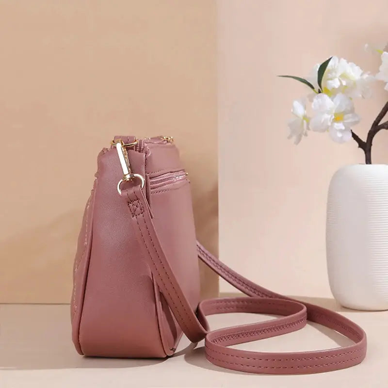 PU leather crossbody bag pink for women with adjustable shoulder strap and zipper closure