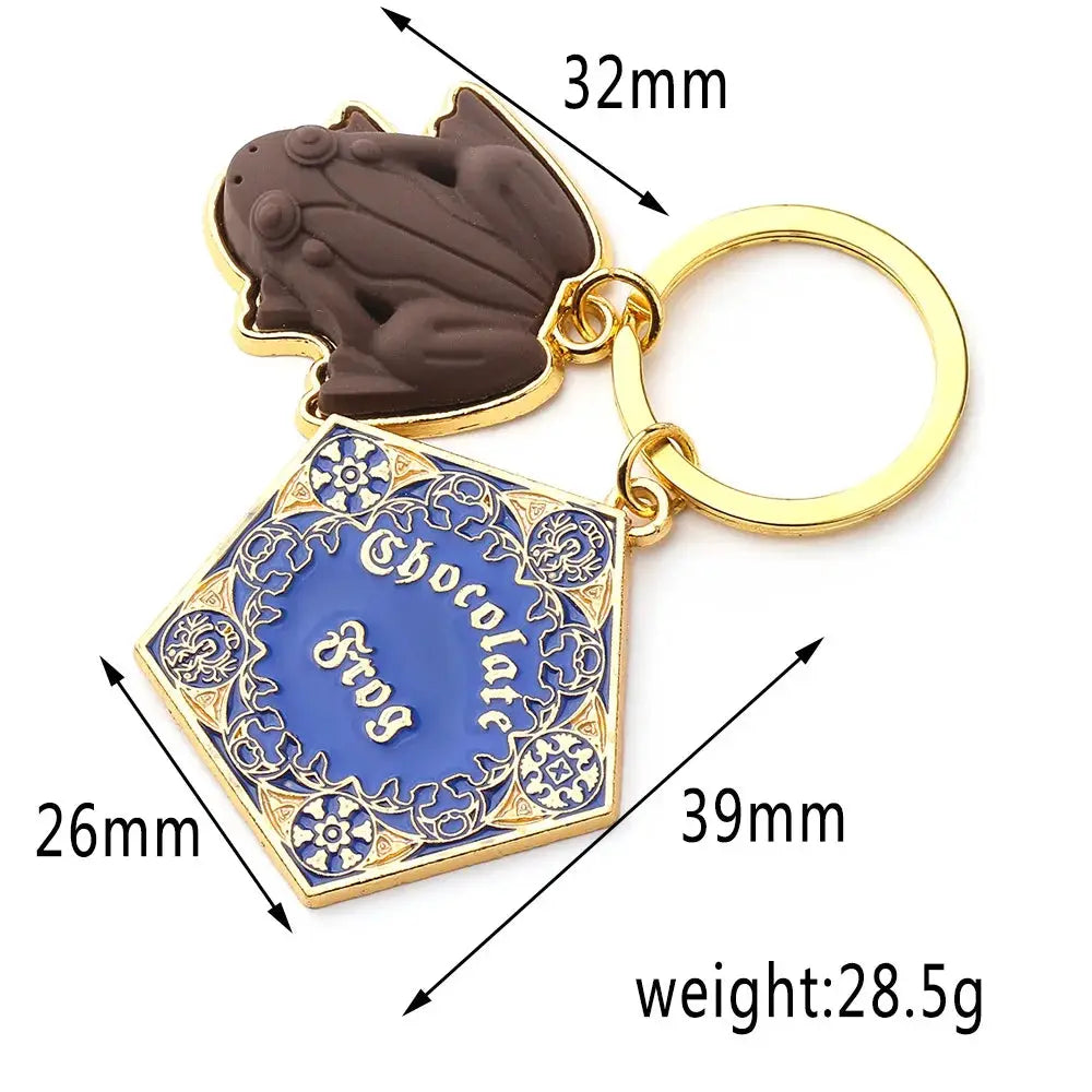 Chocolate Frog keychain from Harry Potter Wizarding World with blue ornate plaque on a gold-tone ring