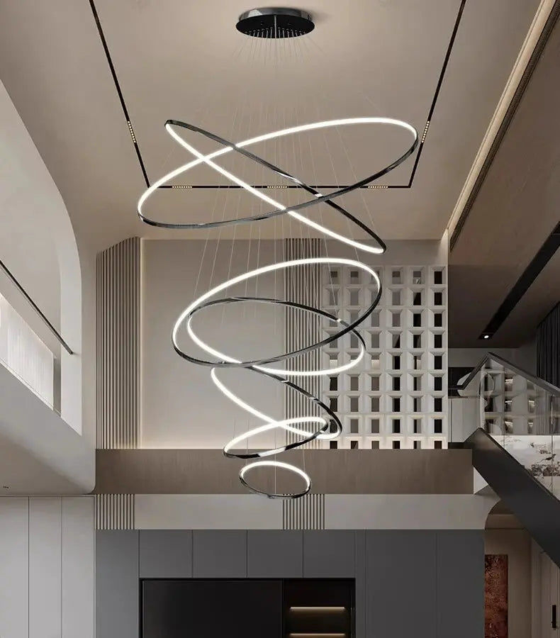 Spiral LED pendant light chandelier for stairs and living room; black metal rings with white glow