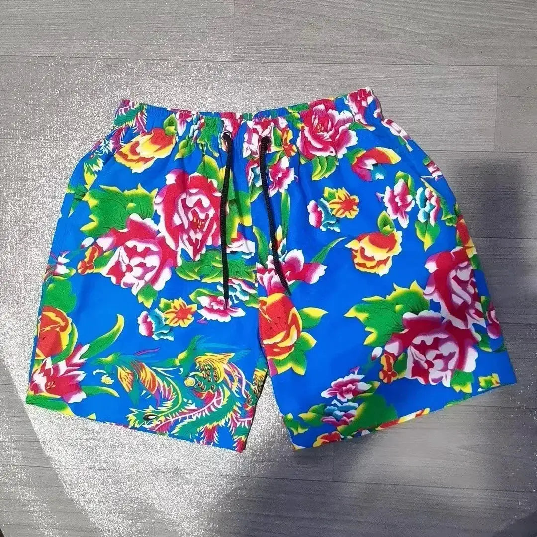Men's blue floral swim shorts with black drawstring