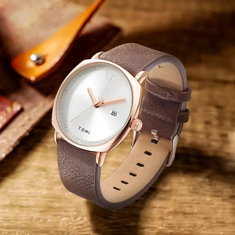 TOMI men's watch with rose-gold case, brown leather strap, white dial and calendar date display.