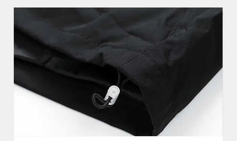 Black men's windbreaker jacket with hood and adjustable hem drawcord.