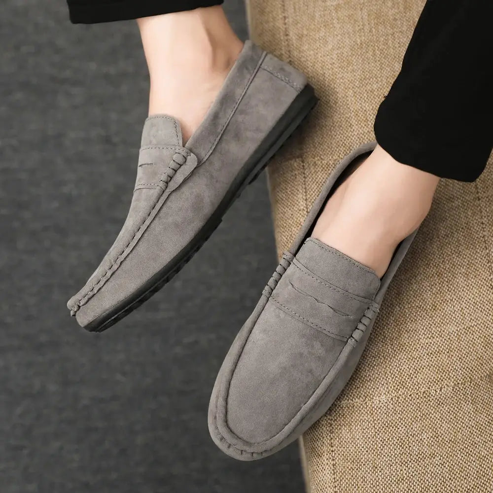 Pair of men's grey suede driving loafers, versatile casual work shoes