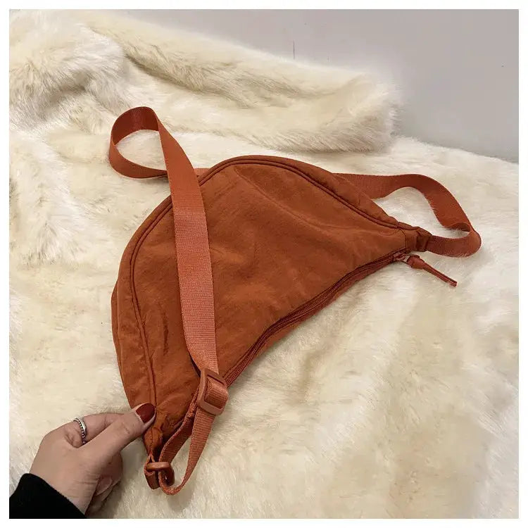 Nylon hobo crossbody bag in rust orange with adjustable strap and large capacity