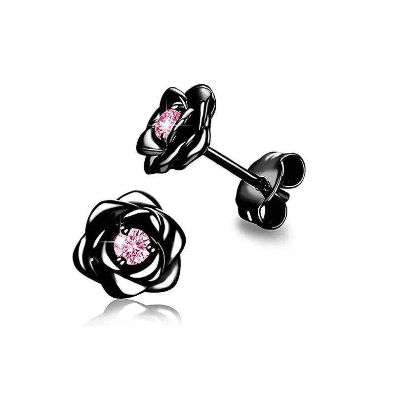 Pair of flower stud earrings with black petals and pink cubic zirconia centers