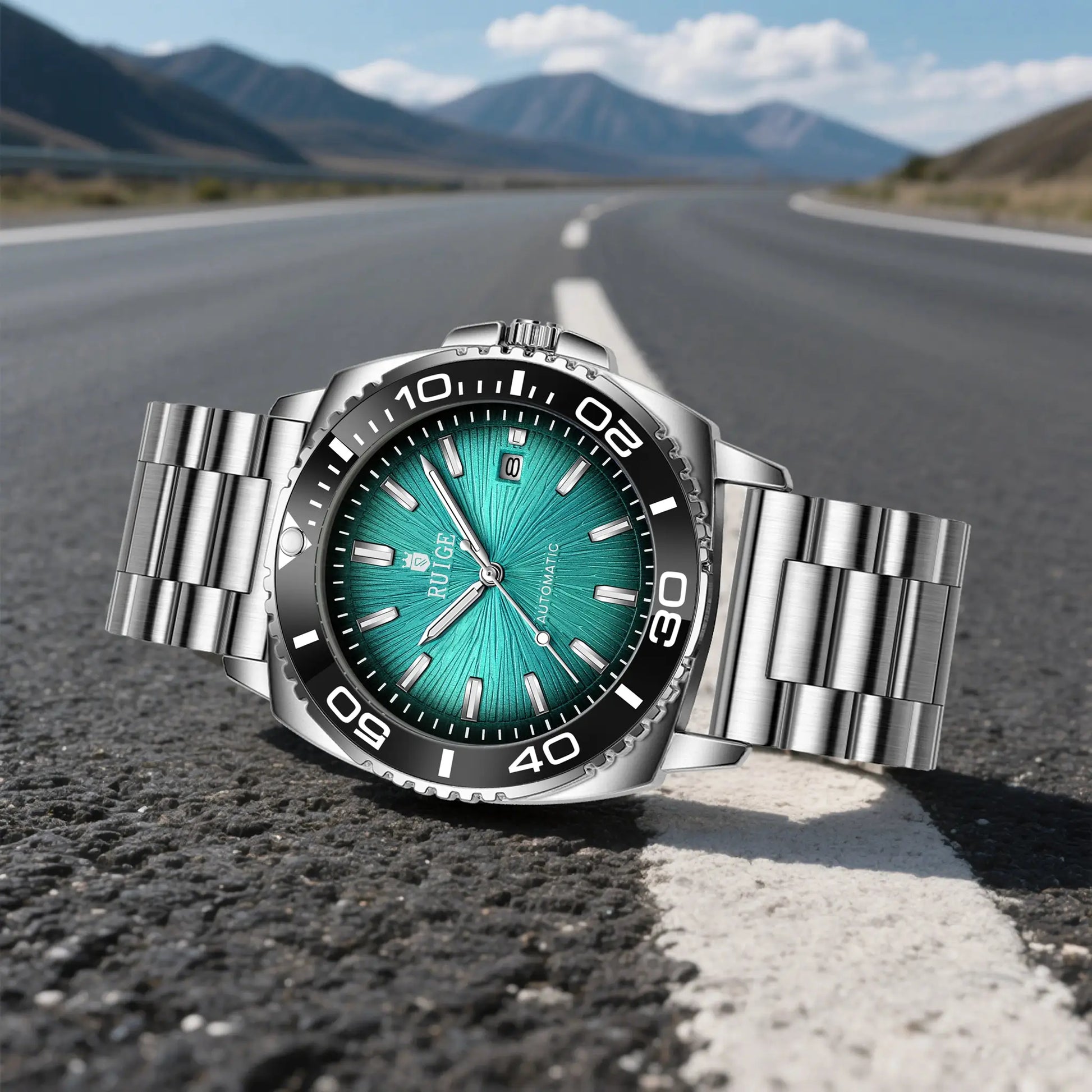 RUIGE men's stainless steel automatic watch with teal dial on a blurred road background.