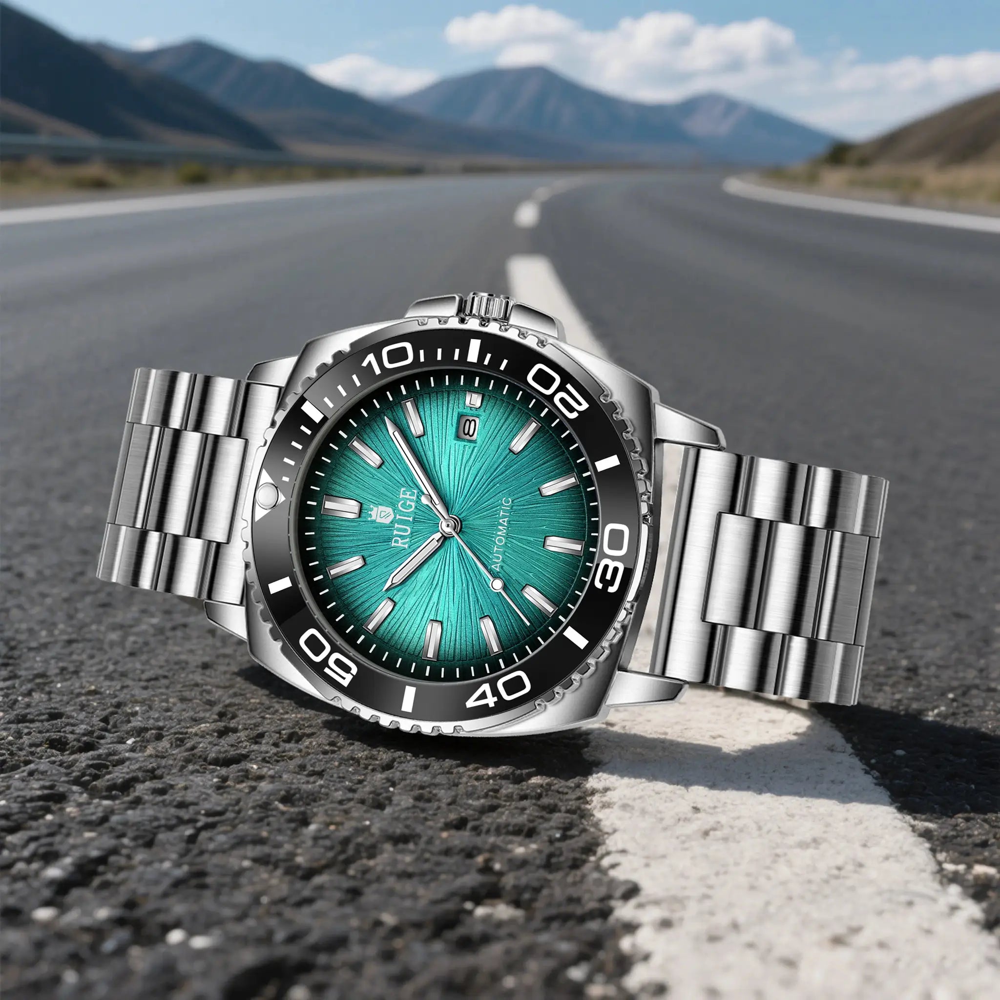 RUIGE men's stainless steel automatic watch with teal dial on a blurred road background.