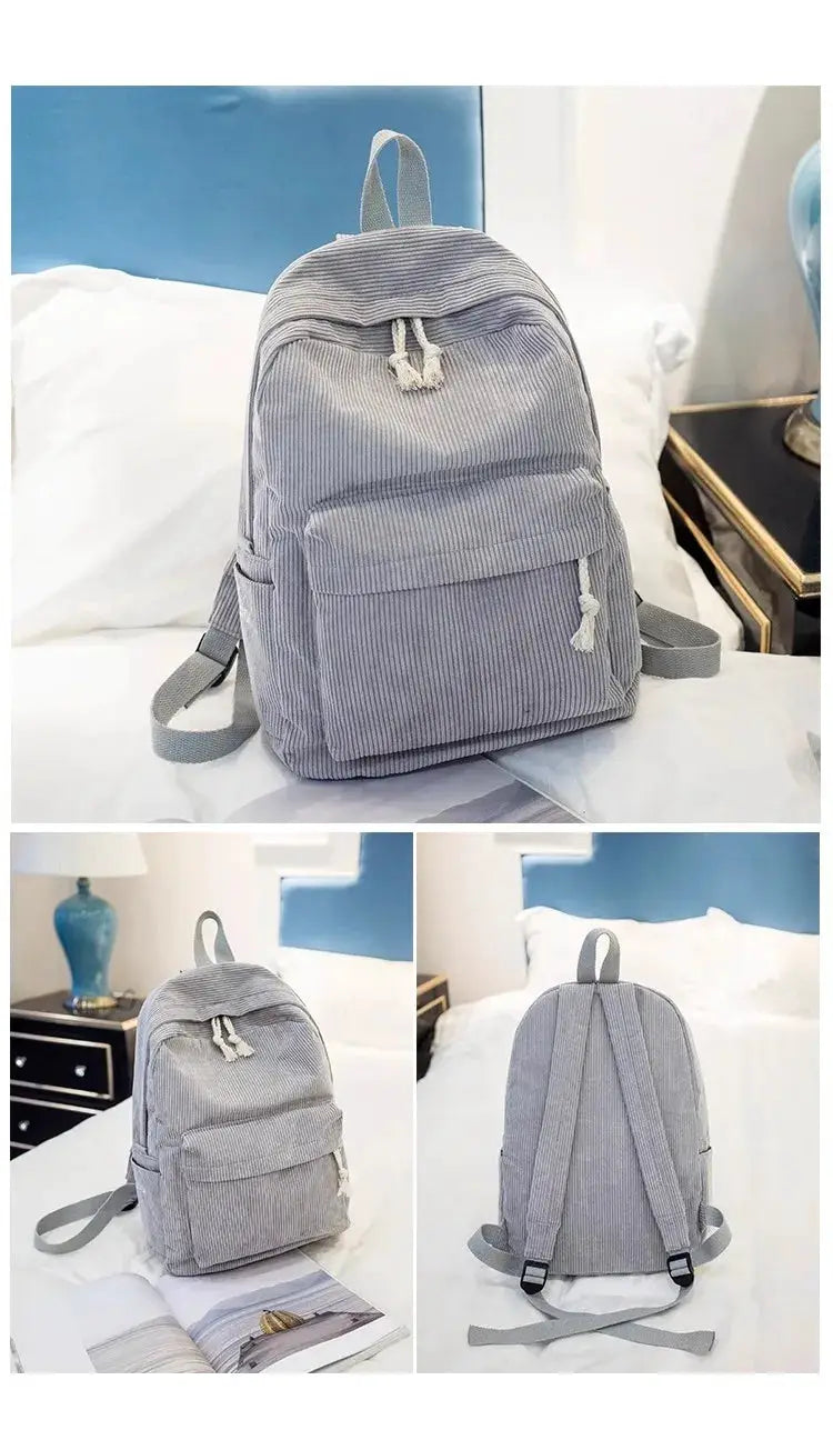 Corduroy kids backpack in gray with front zipper pocket, tassel pulls, top handle and adjustable straps