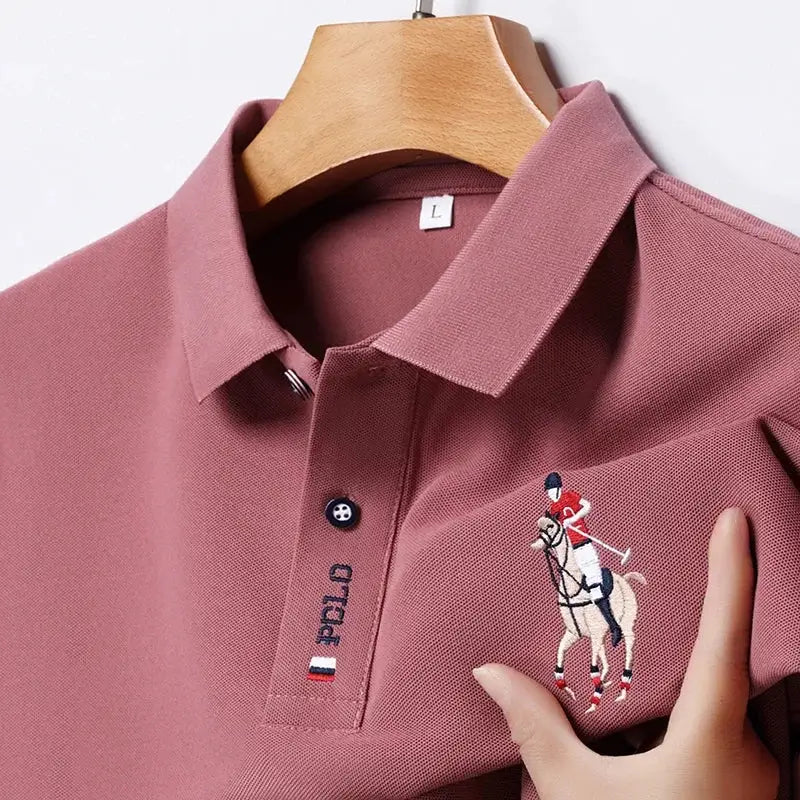 Men's pink polo shirt with embroidered polo player on chest and front placket logo.