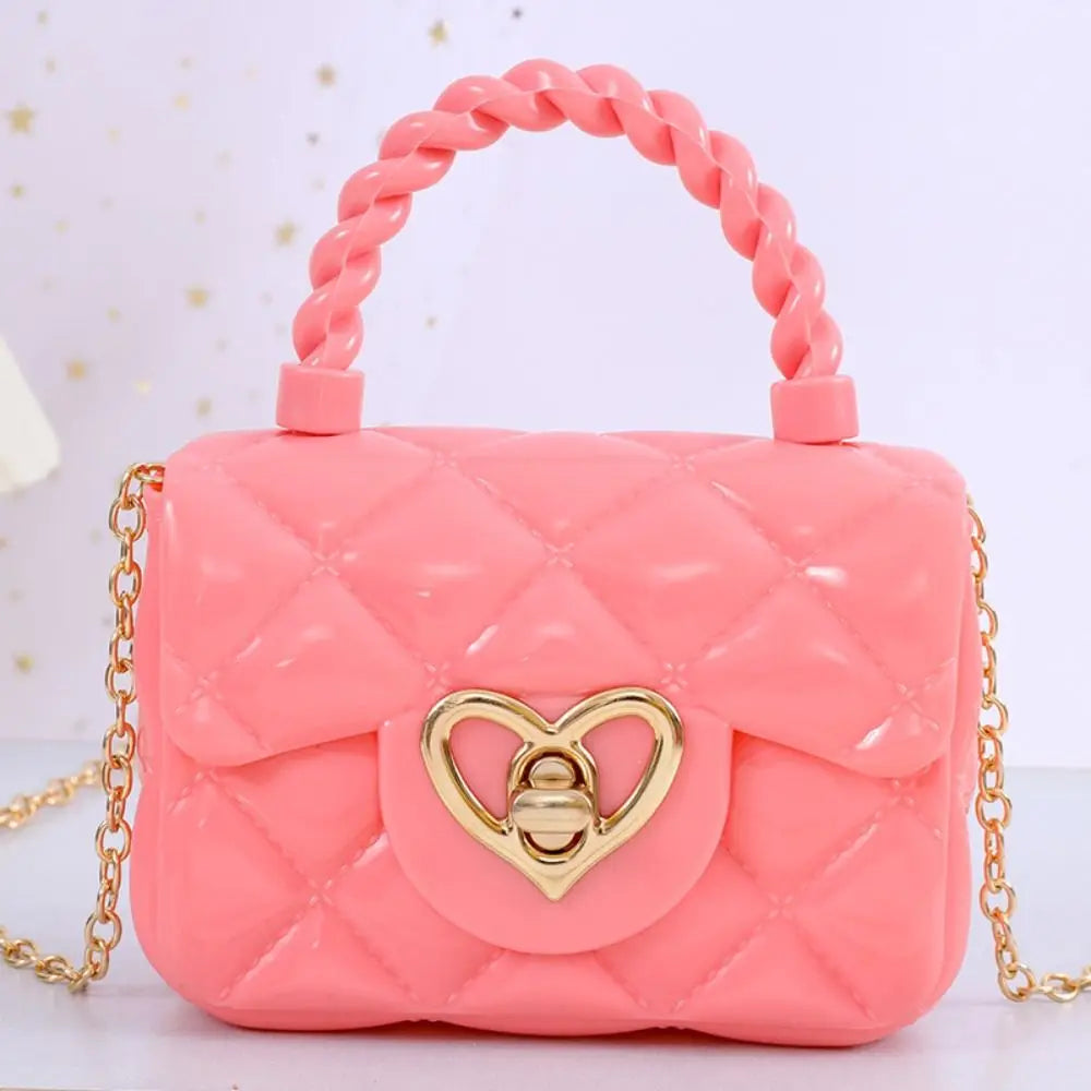 Pink quilted PU leather kids crossbody bag with heart-shaped gold clasp and chain strap