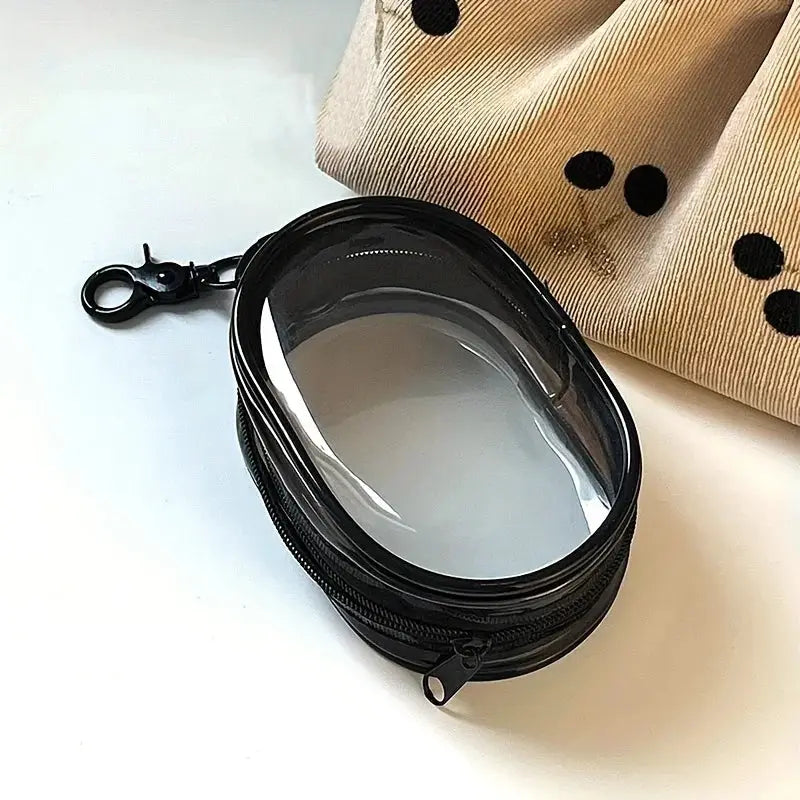 Portable mini clear zipper storage bag by Simples Market for earphones and chargers with black trim and a keychain loop