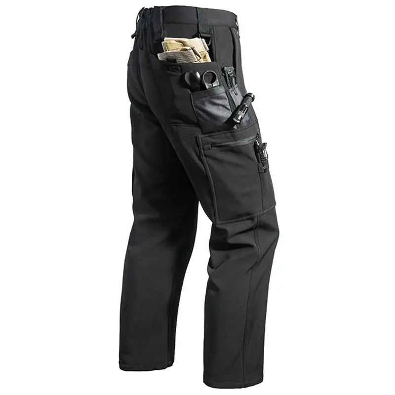 Men's black city cargo pants with multiple tool pockets and side leg pocket, softshell hiking trousers.