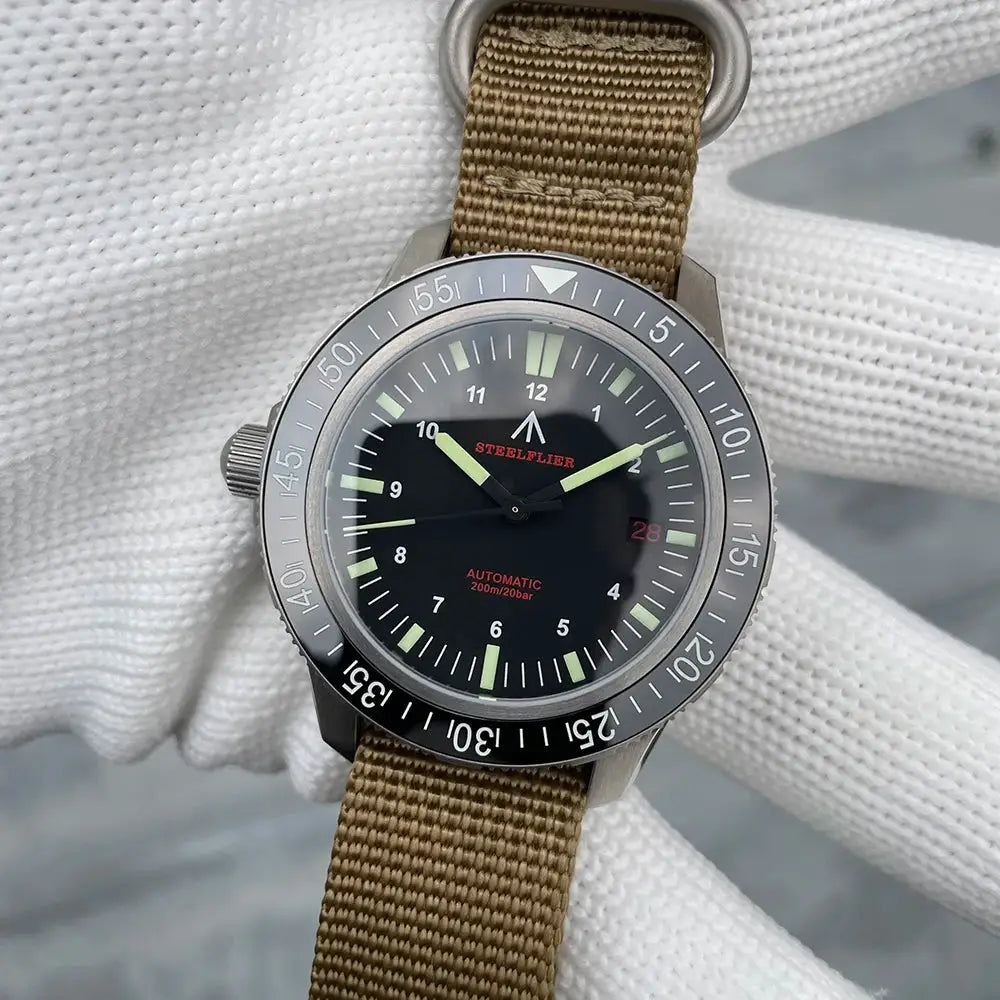 STEELFLIER SF783 automatic dive watch with ceramic bezel and tan nylon strap.