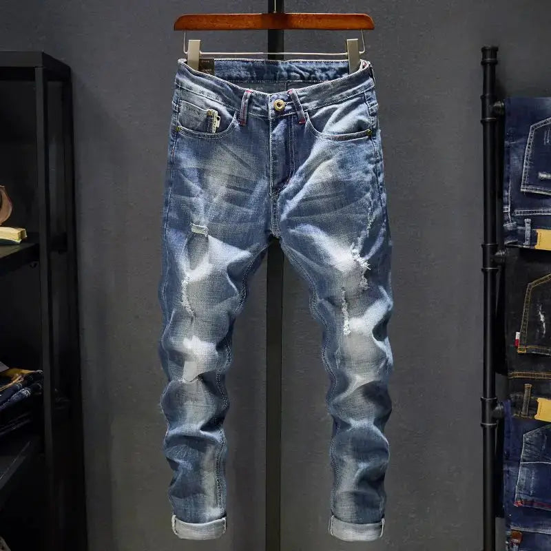 Men's distressed slim-fit straight-leg jeans in blue denim, ripped detailing with rolled cuffs